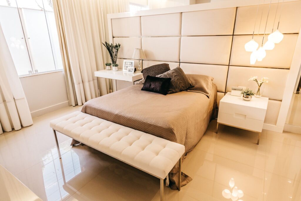 high-angle-shot-bedroom-with-interior-stuff-beige-tones